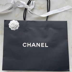 Chanel paper bag, with flower and ribbon